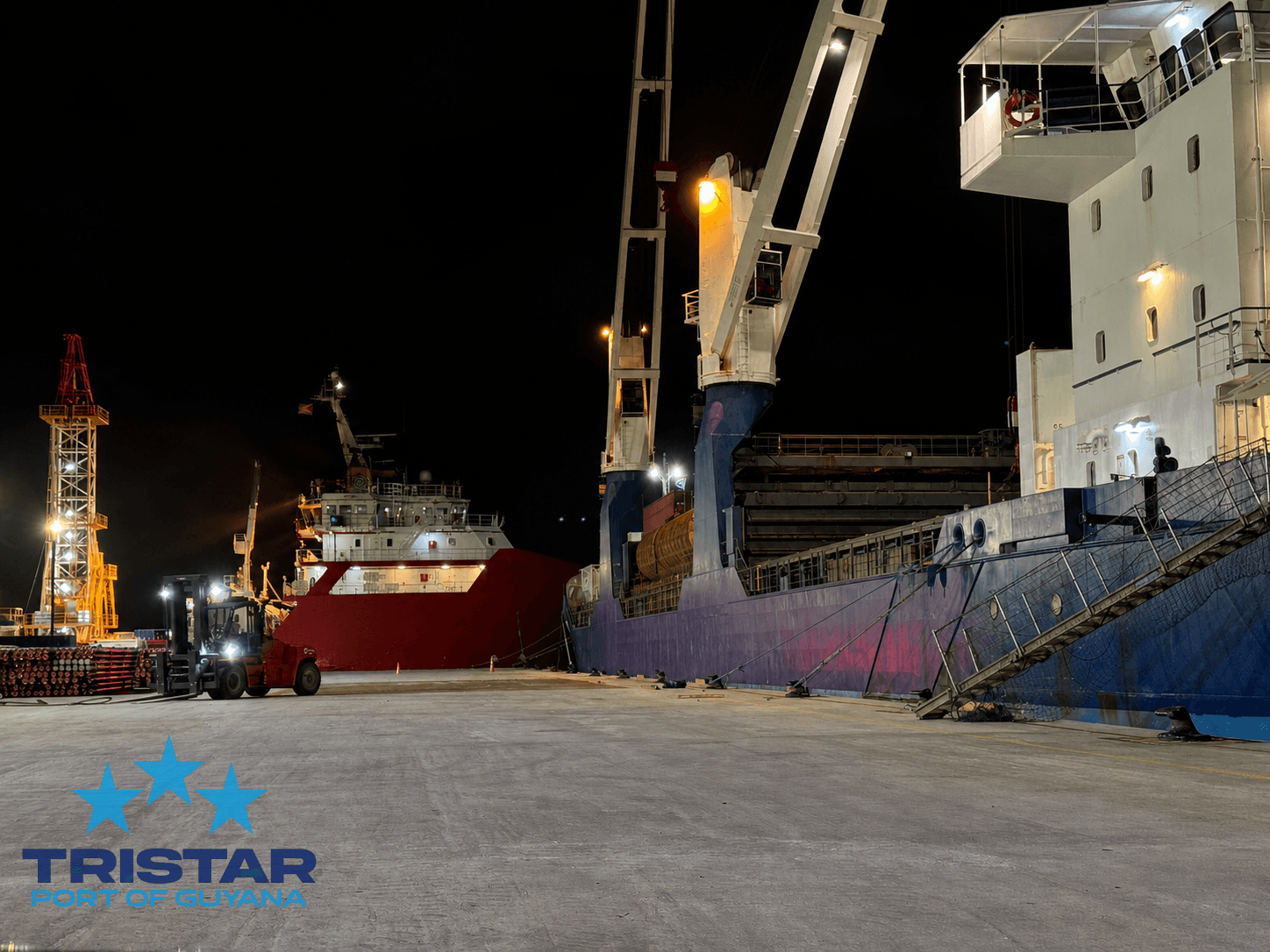 Night-time vessel and cargo handling operations along the Tristar Port of Guyana quayside.